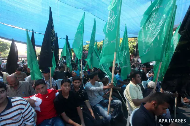 Palestinian relatives prisoners attend a protest calling for the release of their sons held in Israeli jails in front of the headquarters Red Cross in Gaza City, Gaza Strip, on July.16, 2012. Photo by Ashraf Amra