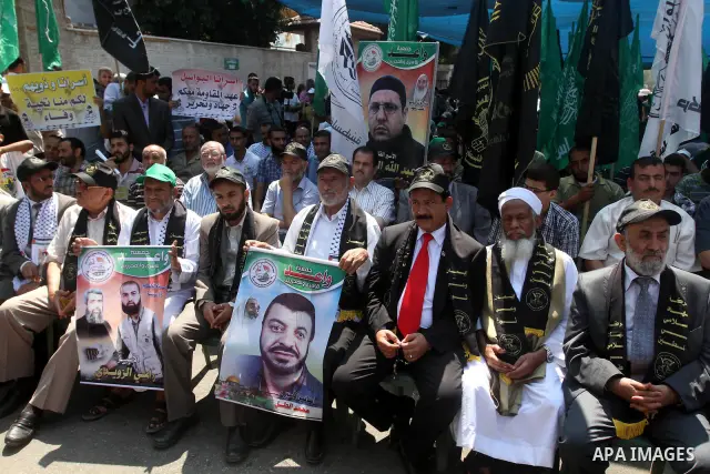 Palestinian relatives prisoners attend a protest calling for the release of their sons held in Israeli jails in front of the headquarters Red Cross in Gaza City, on July.16, 2012. Photo by Majdi Fathi