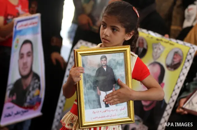 Palestinian relatives prisoners attend a protest calling for the release of their sons held in Israeli jails in front of the headquarters Red Cross in Gaza City, on July.16, 2012. Photo by Majdi Fathi