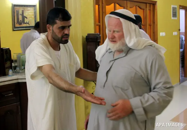 Palestinian former prisoner Adnan Asfour belonging to Hamas movement, greets his family at their home in the West Bank city of Nablus, after being release of prisoners held in Israeli jails, on July 16, 2012. Photo by Ne...