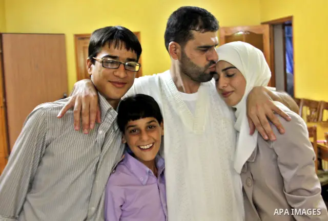 Palestinian former prisoner Adnan Asfour belonging to Hamas movement, with his family at their home in the West Bank city of Nablus, after being release of prisoners held in Israeli jails, on July 16, 2012. Photo by Neda...