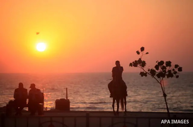 A Palestinian man ride a horse at Gaza beach during hot weather in Gaza city, July 16, 2012. The temperature of the Gaza strip reaches more than 33 degrees Celsius and 61% humidity, Gazans escape to the beach and out fro...