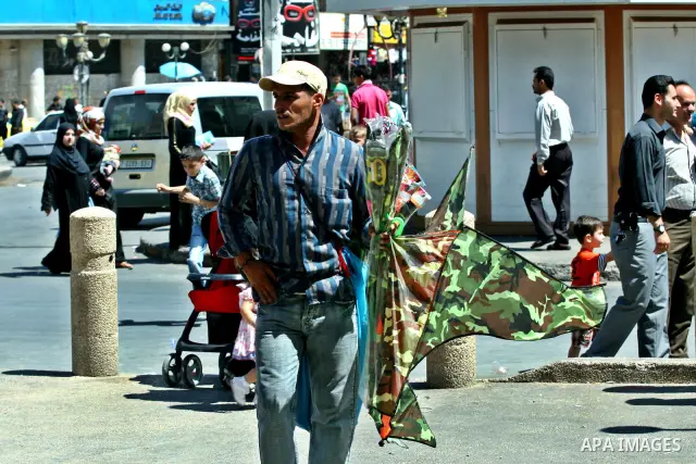 A Palestinian vendor sells kites in the street in the West Bank city of Nablus, on July 17, 2012. Photo by Nedal Eshtayah