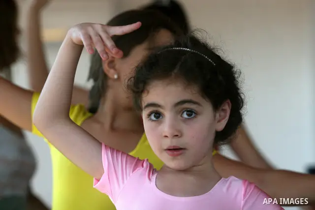 Palestinian girls take part in a ballet class at the Ramallah Ballet Center dance school in the West Bank city of Ramallah July 17, 2012. The center is the first in the occupied West Bank. Photo by Issam Rimawi