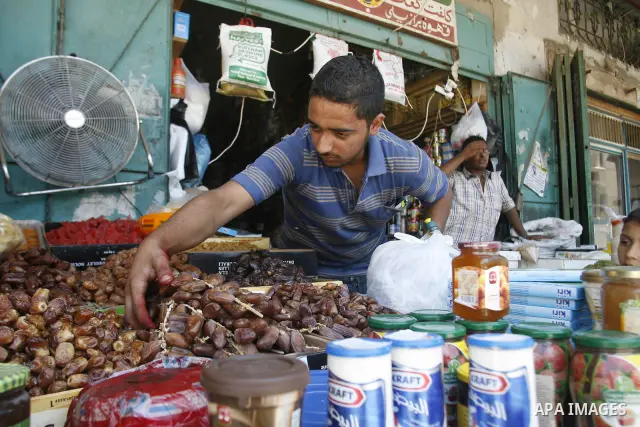 A Palestinian vendor displays foodstuff in preparation for the holy month of Ramadan in the Rafah refugee camp in the southern Gaza Strip on July 17, 2012 . Islam's holy month of Ramadan will begin in few days depending...