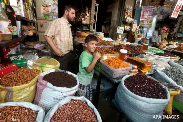 A Palestinian vendor displays goods in preparation for the holy month of Ramadan in the Gaza city on July 17, 2012 . Islam's holy month of Ramadan will begin in few days depending on the sighting of the crescent moon. Mu...