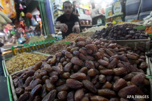 A Palestinian vendor displays goods in preparation for the holy month of Ramadan in the Gaza city on July 17, 2012 . Islam's holy month of Ramadan will begin in few days depending on the sighting of the crescent moon. Mu...