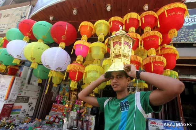 A Palestinian vendor displays goods in preparation for the holy month of Ramadan in the Gaza city on July 17, 2012 . Islam's holy month of Ramadan will begin in few days depending on the sighting of the crescent moon. Mu...