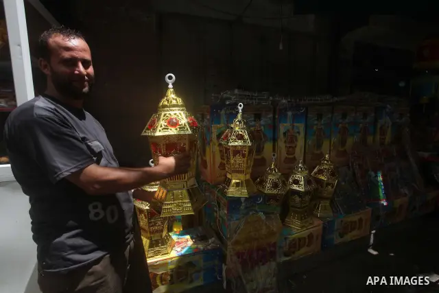 A Palestinian vendor displays goods in preparation for the holy month of Ramadan in the Gaza city on July 17, 2012 . Islam's holy month of Ramadan will begin in few days depending on the sighting of the crescent moon. Mu...