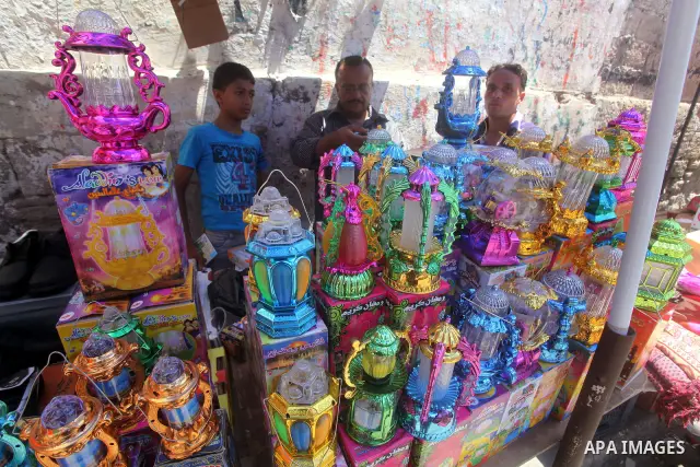 A Palestinian vendor displays goods in preparation for the holy month of Ramadan in the Gaza city on July 17, 2012 . Islam's holy month of Ramadan will begin in few days depending on the sighting of the crescent moon. Mu...