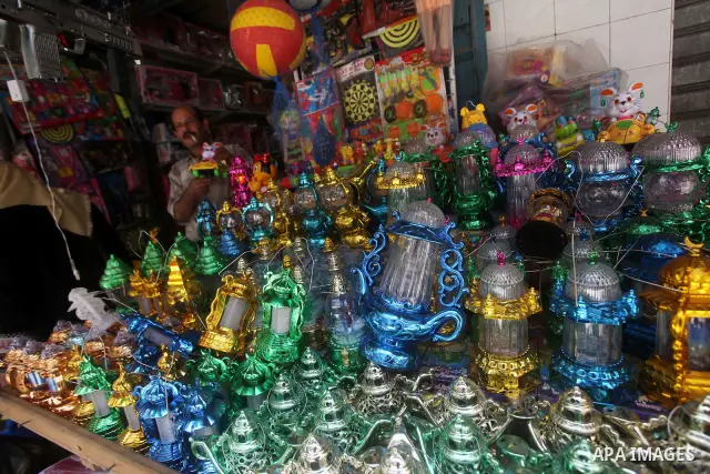 A Palestinian vendor displays goods in preparation for the holy month of Ramadan in the Gaza city on July 17, 2012 . Islam's holy month of Ramadan will begin in few days depending on the sighting of the crescent moon. Mu...