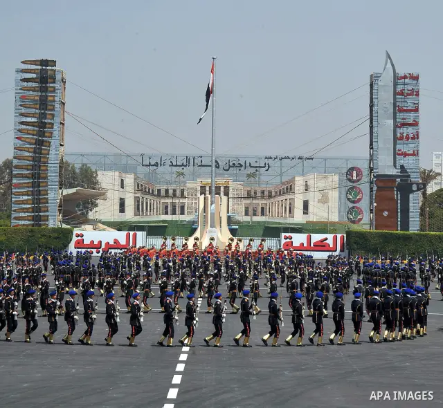 Egyptian troops demonstrate their skills at a graduation ceremony attended by President Mohammed Morsi, unseen, in Cairo, Egypt, Tuesday, July 17, 2012. Egypt's President Mohammed Morsi hailed the Egyptian army and its c...