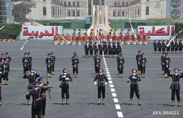 Egyptian troops demonstrate their skills at a graduation ceremony attended by President Mohammed Morsi, unseen, in Cairo, Egypt, Tuesday, July 17, 2012. Egypt's President Mohammed Morsi hailed the Egyptian army and its c...