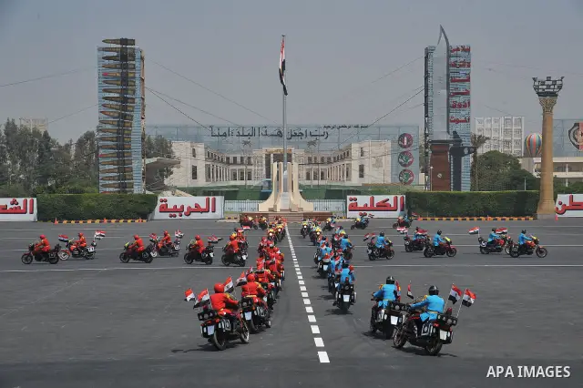 Egyptian troops demonstrate their skills at a graduation ceremony attended by President Mohammed Morsi, unseen, in Cairo, Egypt, Tuesday, July 17, 2012. Egypt's President Mohammed Morsi hailed the Egyptian army and its c...