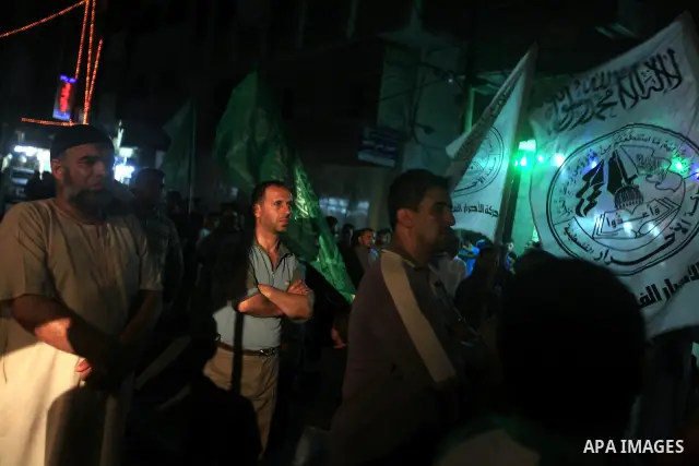 Palestinians Hamas movement supporters hold up banners during a rally in Gaza city, on 18 July 2012. Protesters demand Palestinian President Mahmoud Abbas and Egypt's President Mohamed Morsi to fix electricity crisis in...