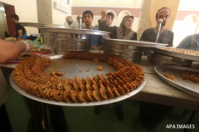 Palestinian vendors distribute sweets after the results of high school exams, or "Tawjihi", in Gaza city on July 19, 2012. Photo by Ashraf Amra