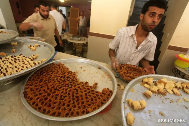 Palestinian vendors sell sweets after the results of high school exams, or "Tawjihi", in Gaza city on July 19, 2012. Photo by Ashraf Amra