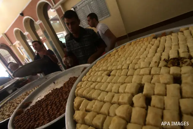 Palestinian vendors sell sweets after the results of high school exams, or "Tawjihi", in Gaza city on July 19, 2012. Photo by Ashraf Amra