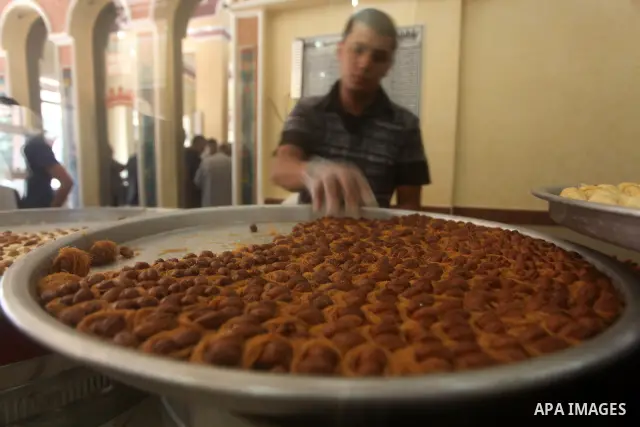 Palestinian vendors sell sweets after the results of high school exams, or "Tawjihi", in Gaza city on July 19, 2012. Photo by Ashraf Amra