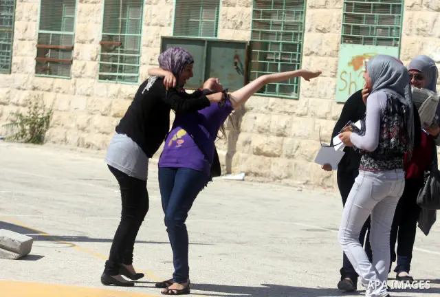 Palestinian high school student celebrated after hearing the results of their final exams known as "Tawjihi" in the West Bank city of Ramallah on July 19, 2012. The Ministry of Education in Gaza Strip and the West Bank a...