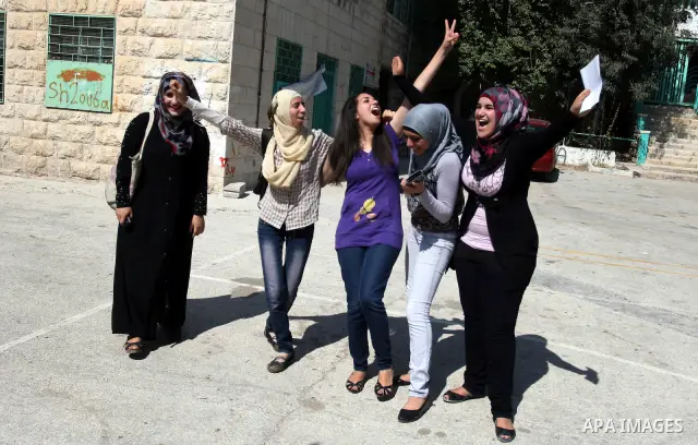 Palestinian high school student celebrated after hearing the results of their final exams known as "Tawjihi" in the West Bank city of Ramallah on July 19, 2012. The Ministry of Education in Gaza Strip and the West Bank a...