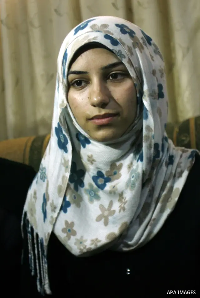 A Palestinian high school student, Nourhan Abu Obaid celebrates with her family after heard the results of her final exams known as "Tawjihi" in Rafah refugee camp southern Gaza strip, on July 19, 2012. The Ministry of E...