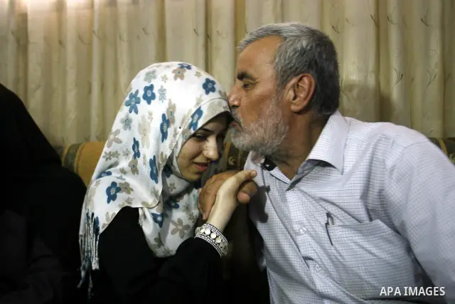 A Palestinian high school student, Nourhan Abu Obaid celebrates with her family after heard the results of her final exams known as "Tawjihi" in Rafah refugee camp southern Gaza strip, on July 19, 2012. The Ministry of E...