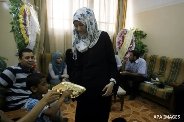 A Palestinian high school student, Nourhan Abu Obaid celebrates with her family after heard the results of her final exams known as "Tawjihi" in Rafah refugee camp southern Gaza strip, on July 19, 2012. The Ministry of E...