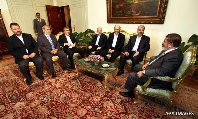 Egypt's president Mohamed Mursi (R) meets with Hamas leader Khaled Meshaal (2nd R) and members of Hamas at the presidential palace in Cairo July 19, 2012. Photo by Mohammed Al-Hams