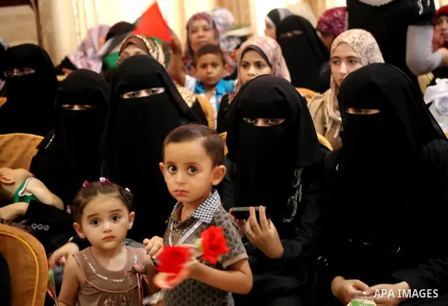 Palestinians attend the ceremony for superior high school students in Gaza city, on 19 July 2012. The Ministry of Education in Gaza Strip announced the final results of high school final exams known as ''Tawjihi'' coinci...