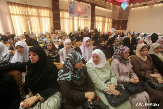 Palestinians attend the ceremony for superior high school students in Gaza city, on 19 July 2012. The Ministry of Education in Gaza Strip announced the final results of high school final exams known as ''Tawjihi'' coinci...
