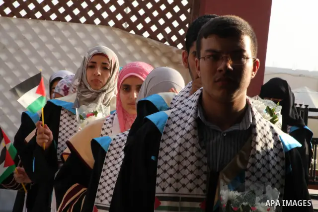 Palestinians attend the ceremony for superior high school students in Gaza city, on 19 July 2012. The Ministry of Education in Gaza Strip announced the final results of high school final exams known as ''Tawjihi'' coinci...