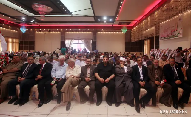 Palestinians attend the ceremony for superior high school students in Gaza city, on 19 July 2012. The Ministry of Education in Gaza Strip announced the final results of high school final exams known as ''Tawjihi'' coinci...
