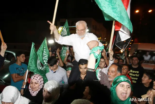 Senior Hamas member Abdel Aziz Dweik celebrates his release near the West Bank city Hebron, Thursday, July 19, 2012. Dweik, 64, was freed Thursday after serving six months in an Israeli jail without charges. Photo by Mam...