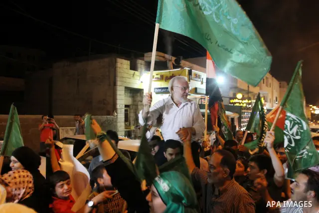 Senior Hamas member Abdel Aziz Dweik celebrates his release near the West Bank city Hebron, Thursday, July 19, 2012. Dweik, 64, was freed Thursday after serving six months in an Israeli jail without charges. Photo by Mam...