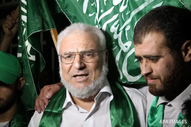 Senior Hamas member Abdel Aziz Dweik celebrates his release near the West Bank city Hebron, Thursday, July 19, 2012. Dweik, 64, was freed Thursday after serving six months in an Israeli jail without charges. Photo by Mam...