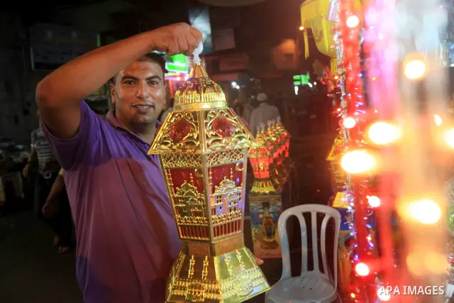 A Palestinian muslim Family buy electric lights for the month of Ramadan, in preparation for the muslim holy month, at the old market on 19 July 2012 in gaza city. Ramadan is the ninth month of the Islamic calender, a mo...