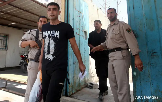 Palestinian prisoners prepare to be freed from a Hamas-run jail in Gaza City on July 21, 2012. Palestinian Hamas police released prisoners because of the approaching holy month of Ramadan. Photo by Momen Faiz