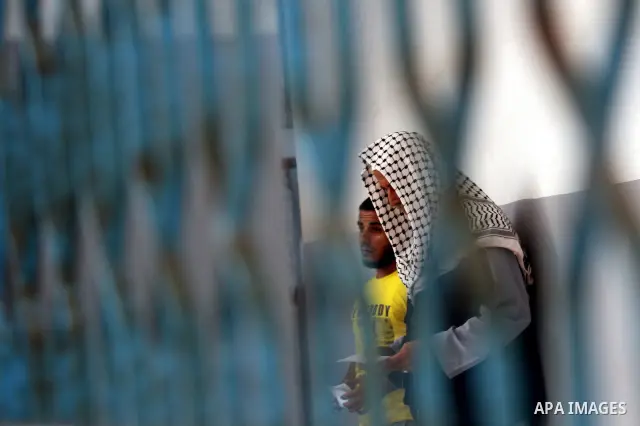 Palestinian prisoners prepare to be freed from a Hamas-run jail in Gaza City on July 21, 2012. Palestinian Hamas police released prisoners because of the approaching holy month of Ramadan. Photo by Momen Faiz