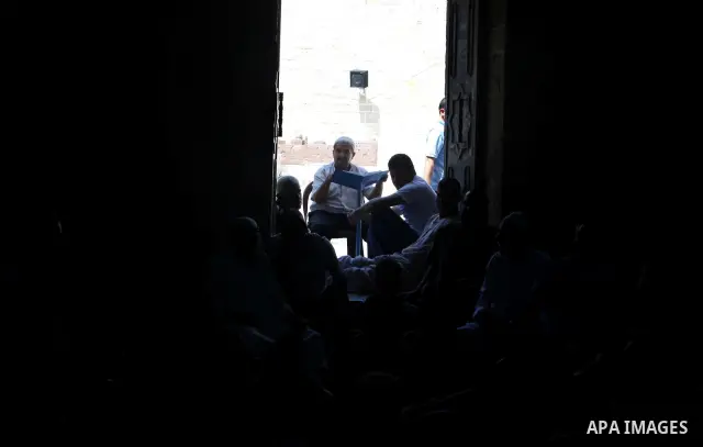 Palestinian muslims read the holy Qur'an at al-Omari mosque in Gaza city, on 21 July 2012. Muslims around the world refrain from eating, drinking and sexual intercourse from dawn till dusk during Ramadan, the holiest mon...