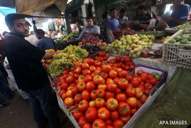A Palestinian vendor displays goods in front of his shop in Gaza city on the second day of the holy month of Ramadan, on 21 July 2012. Muslims around the world abstain from eating, drinking and conducting sexual relation...
