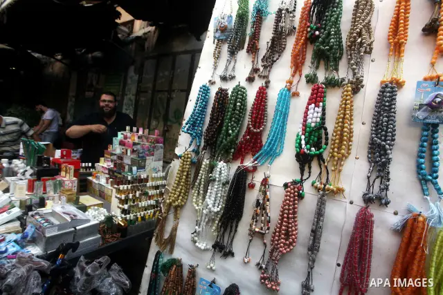 A Palestinian vendor displays goods in front of his shop in Gaza city on the second day of the holy month of Ramadan, on 21 July 2012. Muslims around the world abstain from eating, drinking and conducting sexual relation...