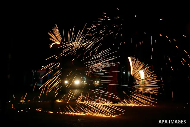 A Palestinian child lights fireworks to celebrate the second day of the Muslim Holy fasting month of Ramadan in Rafah in south of Gaza Strip on 21 July 2012. Muslims throughout the world are celebrating the fasting month...