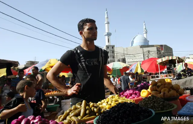 A Palestinian vendor sells pickles at a market on the second day of the holy month of Ramadan, at a shop in Rafah in south of Gaza Strip, on 21 July 2012. Muslims around the world abstain from eating, drinking and conduc...
