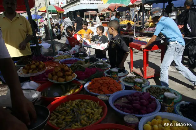 A Palestinian vendor sells pickles at a market on the second day of the holy month of Ramadan, at a shop in Rafah in south of Gaza Strip, on 21 July 2012. Muslims around the world abstain from eating, drinking and conduc...