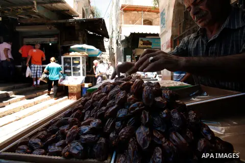 A Palestinian vendor displays his goods in Jerusalem old city on the second day of the holy month of Ramadan, on 21 July 2012. Muslims around the world abstain from eating, drinking and conducting sexual relations from d...