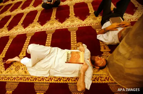 Palestinians take rest at al-Aqsa Mosque in Jerusalem's Old City during the night prayer on the second day of the holy month of Ramadan, on 21 July 2012. Muslims around the world abstain from eating, drinking and conduct...