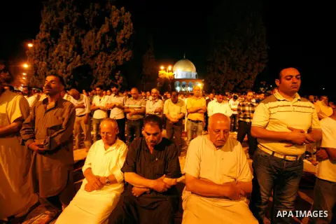 Palestinian worshippers attend night prayer at al-Aqsa Mosque in Jerusalem's Old City on the second day of the holy month of Ramadan, on 21 July 2012. Muslims around the world abstain from eating, drinking and conducting...