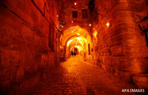 Palestinians walk near al-Aqsa Mosque in Jerusalem's Old City following the night prayer on the second day of the holy month of Ramadan, on 21 July 2012. Muslims around the world abstain from eating, drinking and conduct...