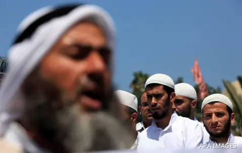 Palestinians member of the Ministry of Awqaf and Religious Affairs, during a demonstration calling to stop killing the Burmese Muslims in Myanmar, in Gaza City, July 22, 2012. Dozens of Muslims were killed and thousands...